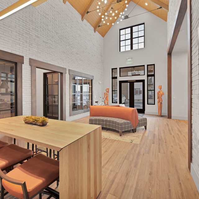 Camber Apartments - Resident Clubhouse Lounge Area with High Table and Chairs